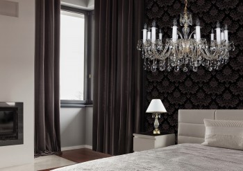 Table lamps and chandelier in bedroom